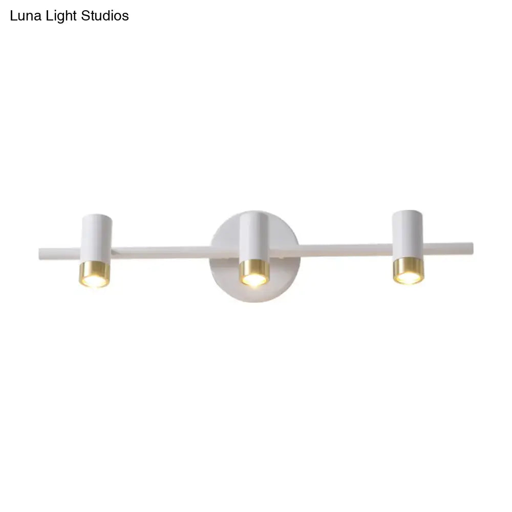 Minimalist white and gold three-arm vanity lamp with sleek cylindrical bulb base designed for bathroom light type
