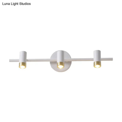 Minimalist white and gold three-arm vanity lamp with sleek cylindrical bulb base designed for bathroom light type