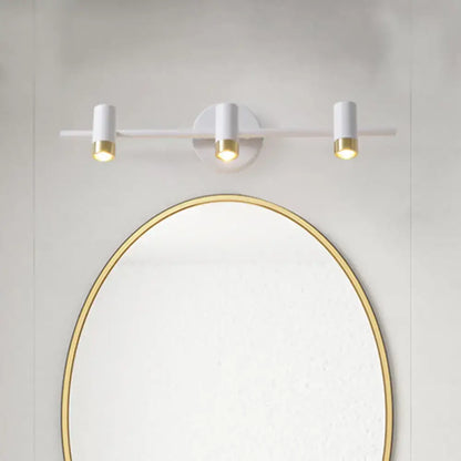 Minimalist white and gold three-arm vanity lamp with cylindrical bulb base on a sleek horizontal bar light type