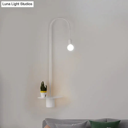 Minimalist white gooseneck wall sconce with curved arm, integrated shelf, and spherical bulb wall light for bedroom use