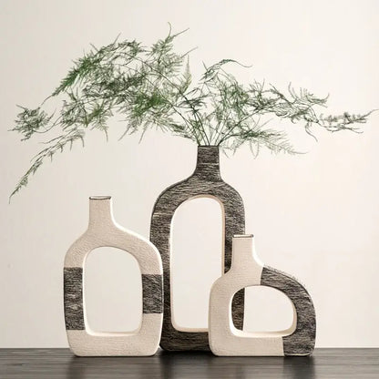 Three modern ceramic flower vases with minimalist white and dark gray geometric stripes for living room decor