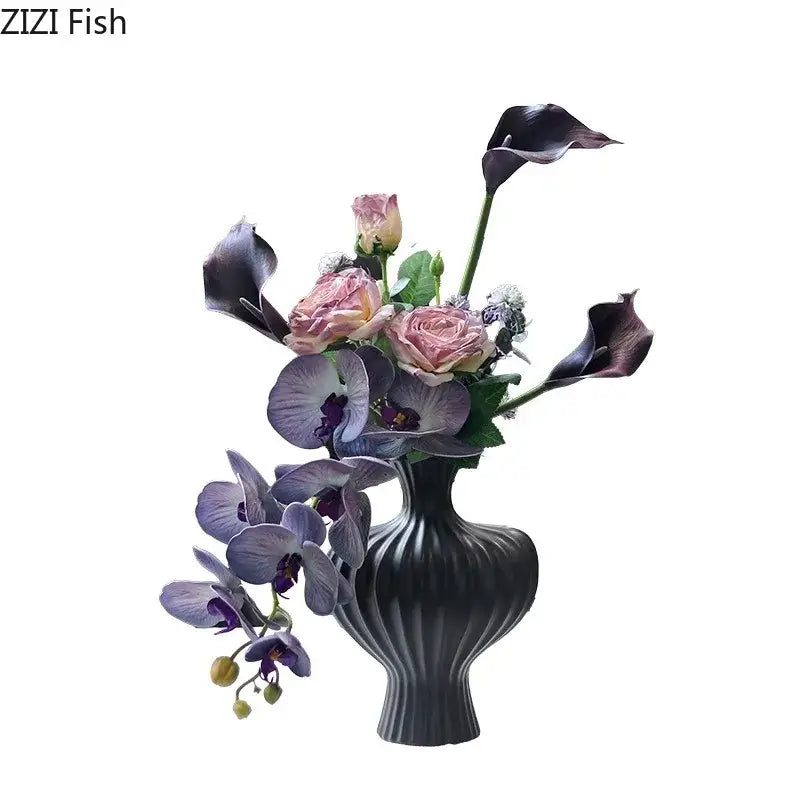Elegant black ribbed heart shape ceramic vase with pink roses purple orchids and dark calla lilies for decorbites heart shape decor