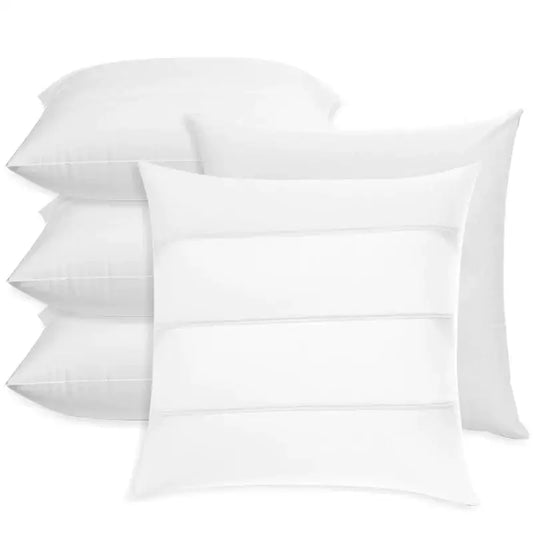 Set of four white inflatable pillow cores with minimalist design and subtle horizontal stitching for bedroom inserts