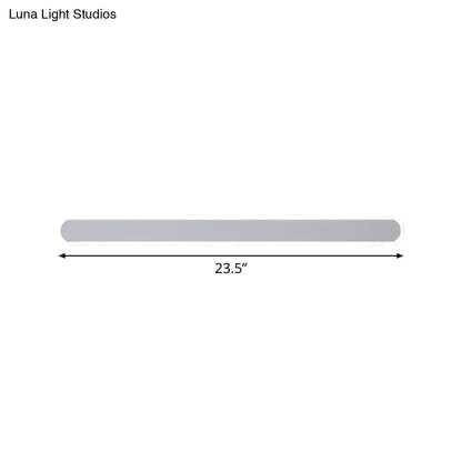 Minimalist gray rectangular wall sconce with smooth finish and warm white light for bathroom mirror lighting