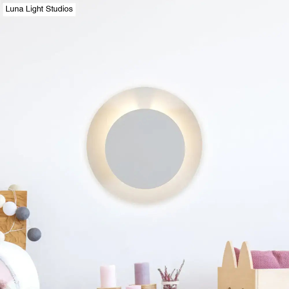 Minimalist white led circular wall sconce lamp with warm glowing ring for bedroom light fixture