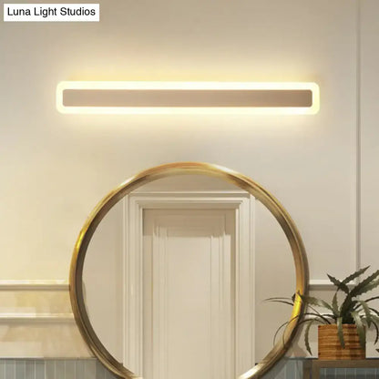 Modern minimalist white led vanity light wall sconce with warm white light and sleek rectangular design for bathroom use