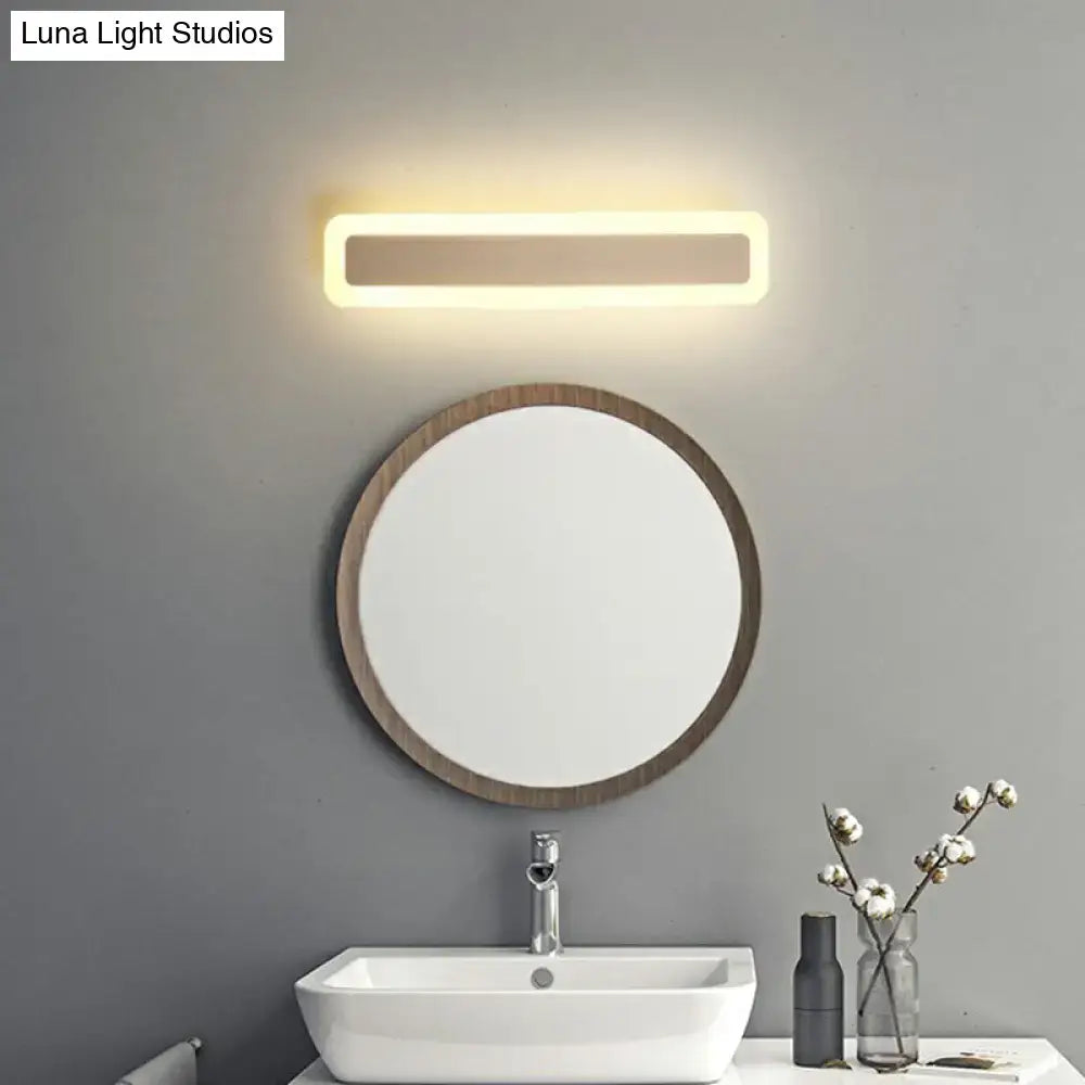 Minimalist white led vanity light bathroom wall sconce with warm glow and sleek metallic finish for modern warmth