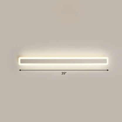 A sleek minimalist white led vanity light wall sconce with warm third gear soft white illumination for bathrooms
