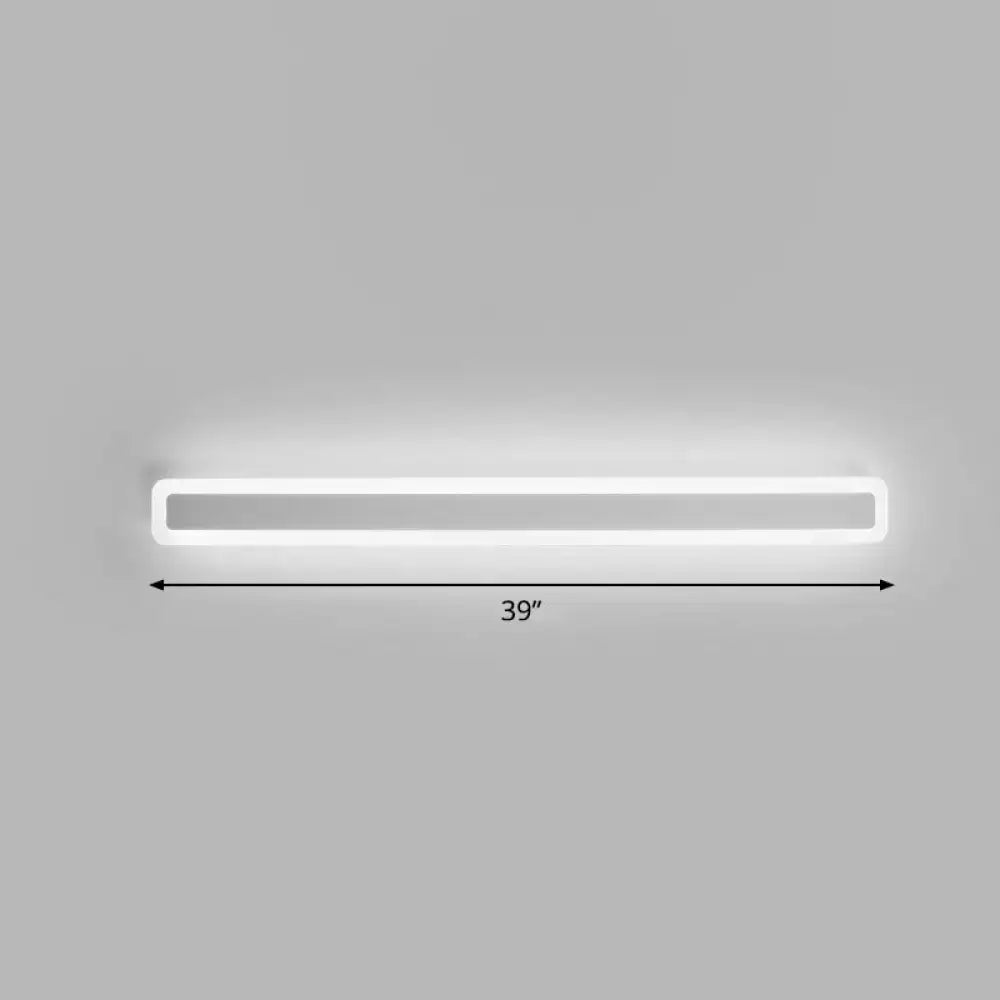 A sleek minimalist white led vanity light wall sconce with soft warm third gear illumination and rectangular design