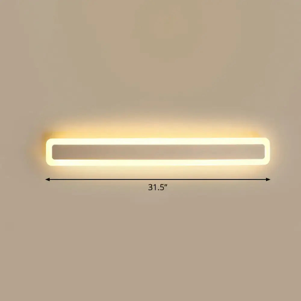 A sleek minimalist white led vanity light wall sconce with warm third glow for bathroom lighting