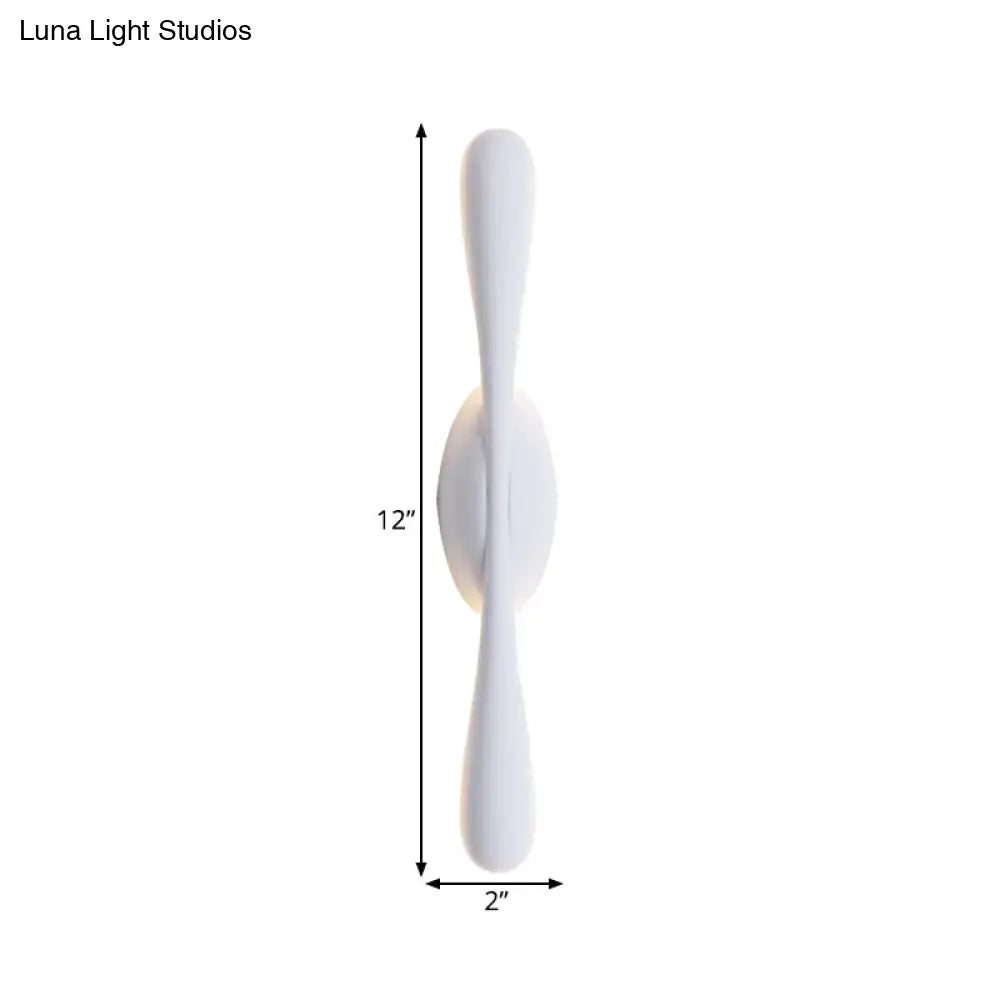 Minimalist white linear wall sconce lighting with sleek curved arms for modern living room decor