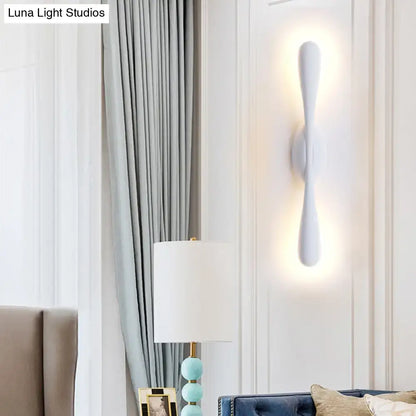 White sleek minimalist linear wall sconce lighting with sculptural design for living room wall mounting
