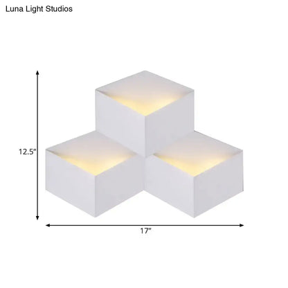 Minimalist white metallic geometric wall mount light with warm yellow glow designed as a corridor wall lamp