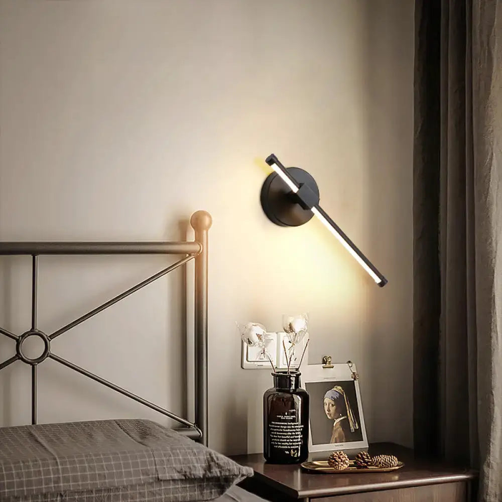 Modern black wall sconce with angular design and white metallic finish for bedroom wall mount lighting maximum bulb wattage