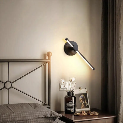 Modern black wall sconce with angular design and white metallic finish for bedroom wall mount lighting maximum bulb wattage