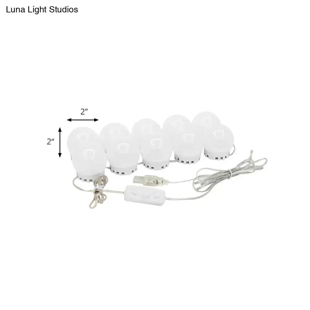 Minimalist white oval led vanity strip with eight white led bulbs and usb power adapter for dressing room lighting
