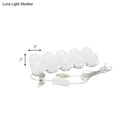 Minimalist white oval led vanity strip with eight white led bulbs and usb power adapter for dressing room lighting