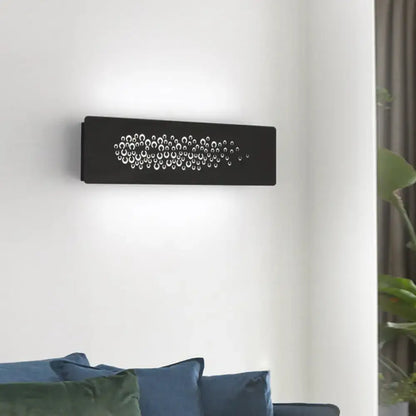 Black rectangular wall lamp with white circular cutouts made of sturdy metal for minimalist bedroom up and down light type