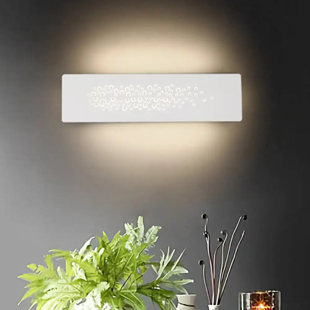 Minimalist white patterned metal wall lamp with sturdy metal cutout design and up and down light for bedroom use