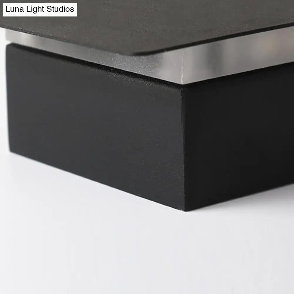 Black minimalist wall lamp with white patterned sturdy metal and silver metallic trim for bedroom up and down light type