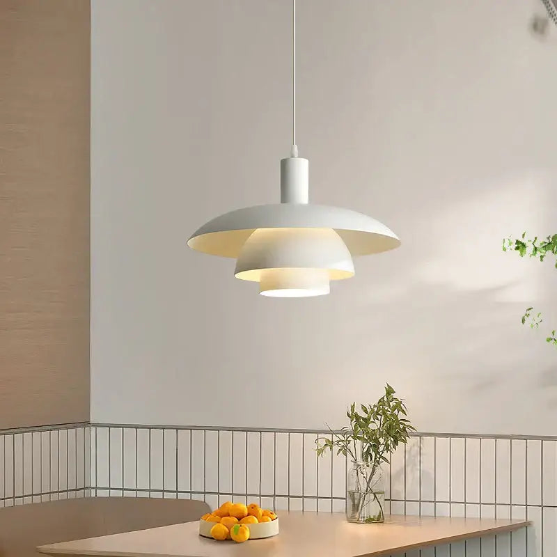 Minimalist white pendant light with layered disc-shaped shades perfect for dining room decorbites cream style decor