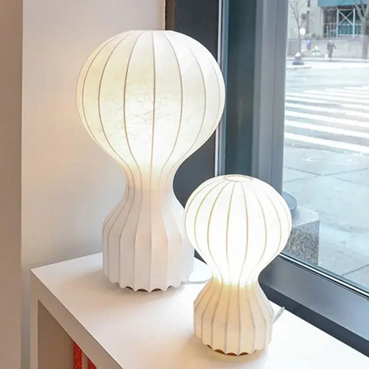 Minimalist white ribbed cocoon silk table lamp with modern sculptural design for bedroom decorbites gatto cocoon