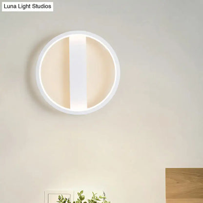 Minimalist white round square led wall sconce with a modern circular design and sleek vertical slit for bedroom lighting