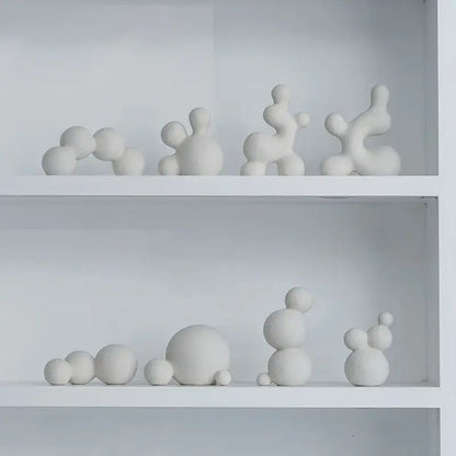 Minimalist white speckled geometric ceramic handicraft sculpture featuring abstract rounded organic shapes for living room decor