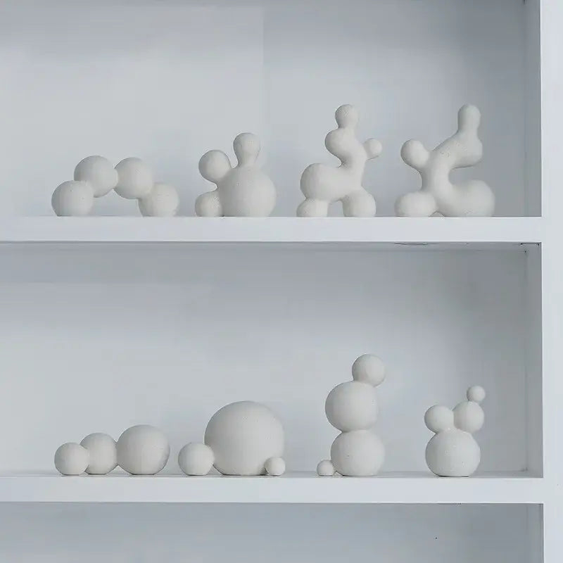 Minimalist white speckled geometric ceramic handicraft sculpture featuring abstract rounded organic shapes for living room decor