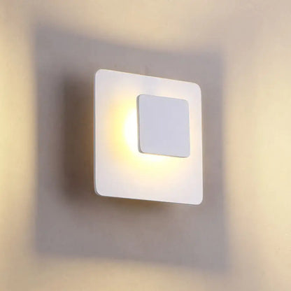 Modern white square led sconce lighting with minimalist design emitting soft white warm light for bedroom ambiance