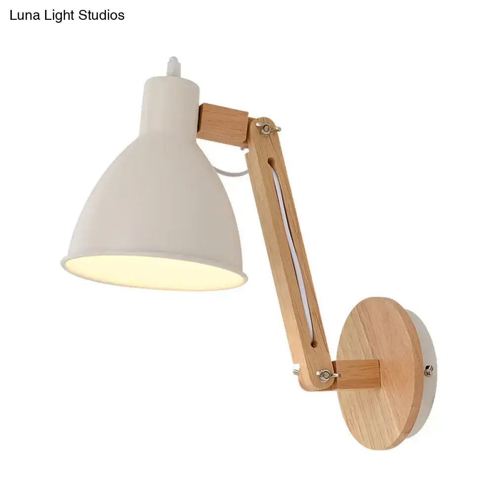 Minimalist white swing arm wall light with matte metal lampshade and light wood articulated arm for bedroom use