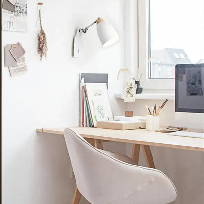 Minimalist white tapered wall light with wood accents featuring a sleek adjustable arm study desk lamp