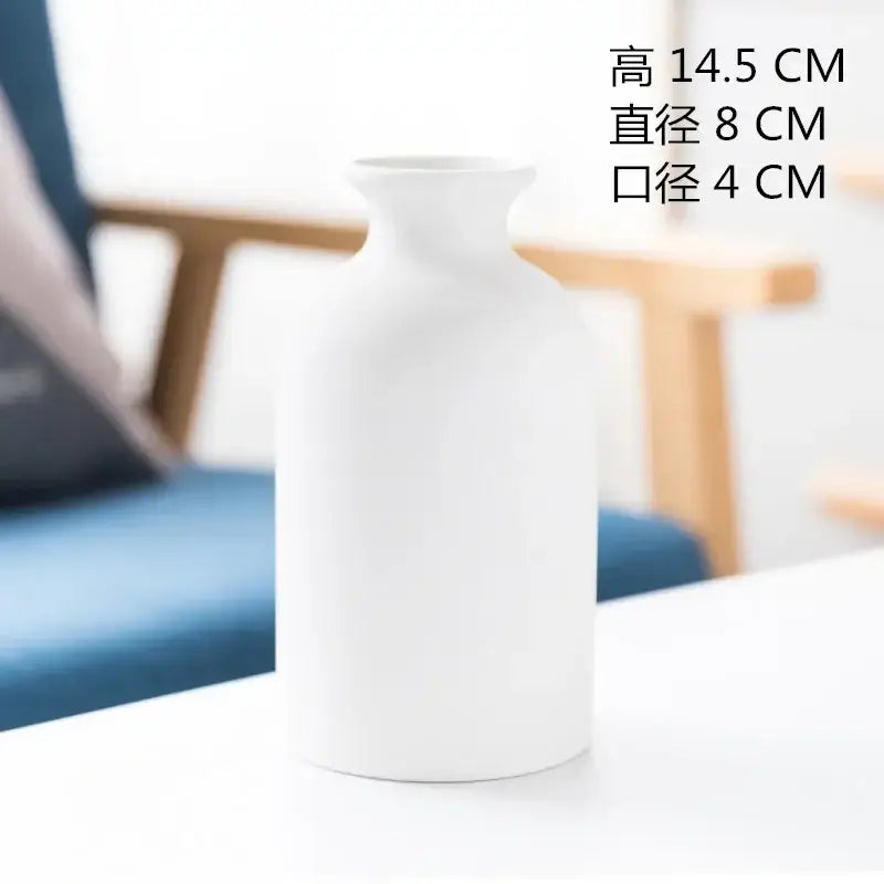 Minimalist white decorbites ceramic vase with smooth matte finish and curved silhouette for dining room decor