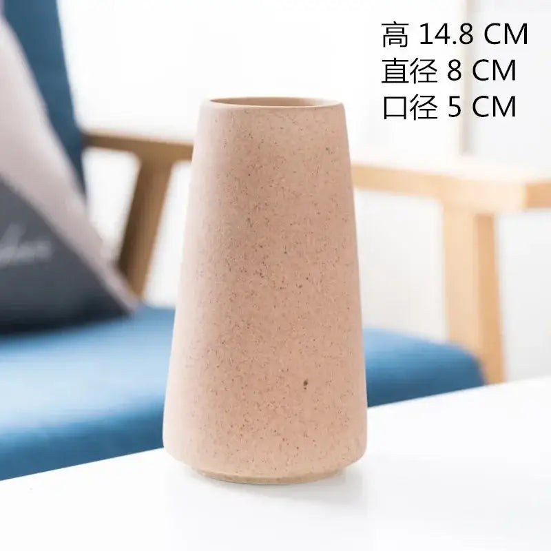 Beige speckled ceramic vase with tapered conical shape from decorbites ceramic vase collection for dining room decor
