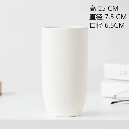 Minimalist white decorbites ceramic vase with smooth matte finish and flared rim for dining room decor