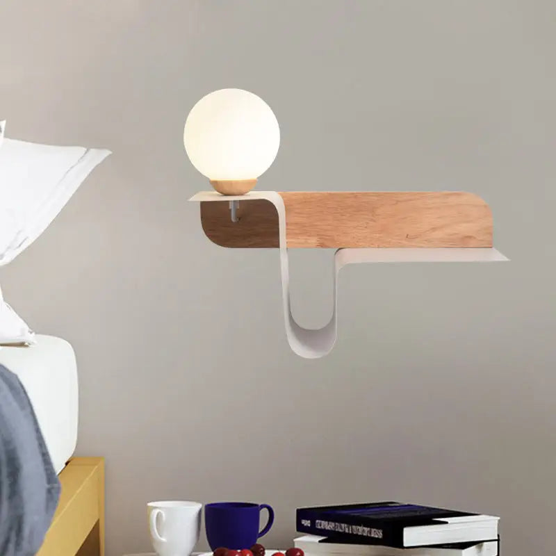 Minimalist white wall lamp with frosted glass shelf and wooden arm features frosted glass spherical led bulb