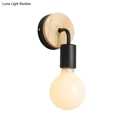 Minimalist white and wood wall sconce with rounded wooden shade and black metal accents direct wired electric light