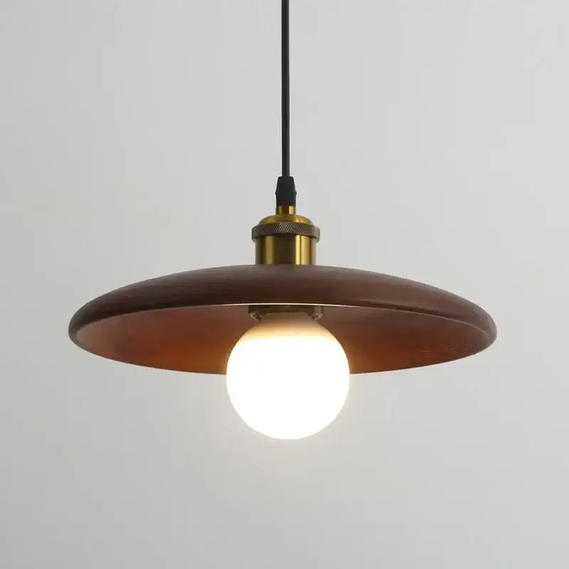 Minimalist warm-toned wooden pendant light with brass fixture, black cord, led bulb, and three-color dimming feature