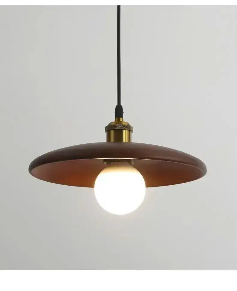 A warm-toned circular wooden pendant light with brass fixture and led bulb featuring three-color dimming for dining rooms