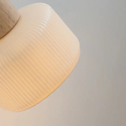 Minimalist decorbites led wall light with cream ribbed glass lampshade and natural wood stem for bedroom decor