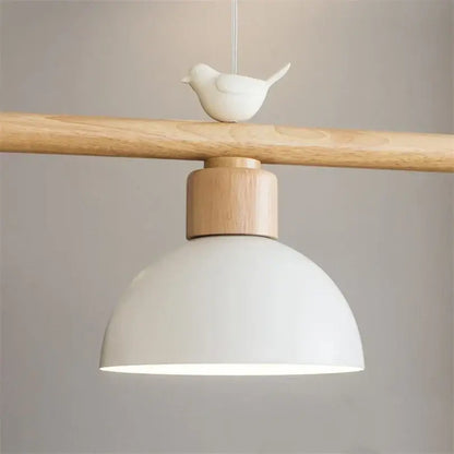 Minimalist white ceramic decorbites bird light pendant with light wood beam and matte dome lamp for dining room decor