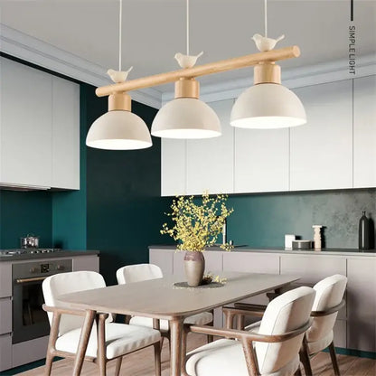 Beige ceramic bird light pendant with wooden rod and finials for minimalist dining room decorbites bird light design