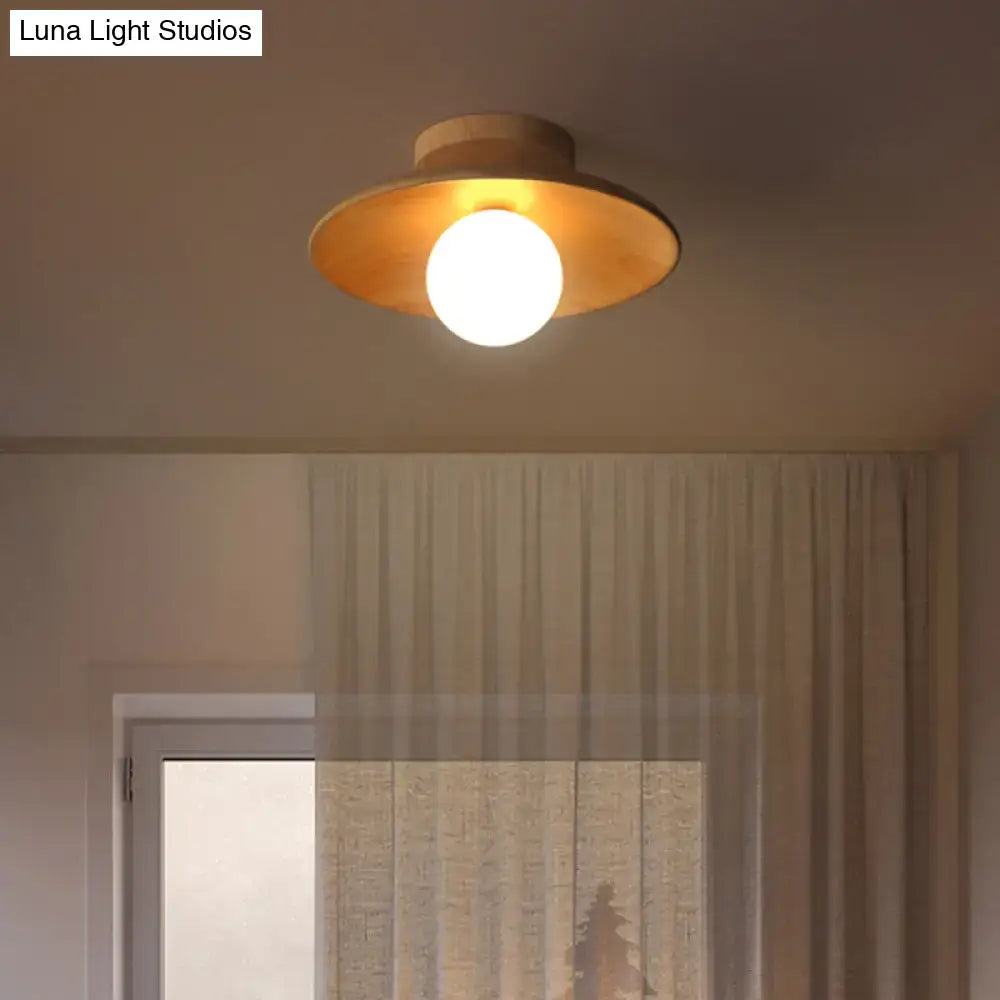DecorBites semi-flush mount ceiling light with warm brass finish, wooden canopy, circular shade, and central globe bulb