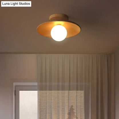 DecorBites semi-flush mount ceiling light with warm brass finish, wooden canopy, circular shade, and central globe bulb