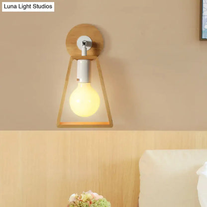 Minimalist wall lamp with warm-toned wooden trapezoid frame and white metal accents for bedroom sconce lighting