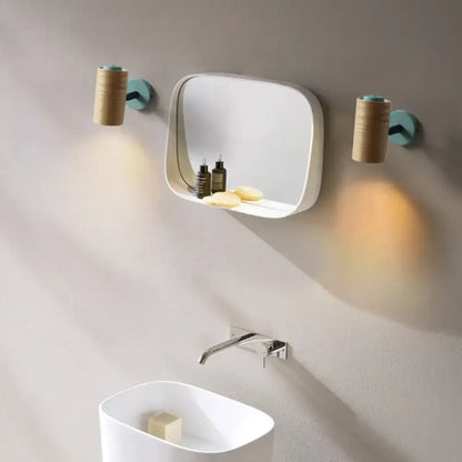 White rectangular minimalist wood wall light fixture with integrated shelf for bathroom use