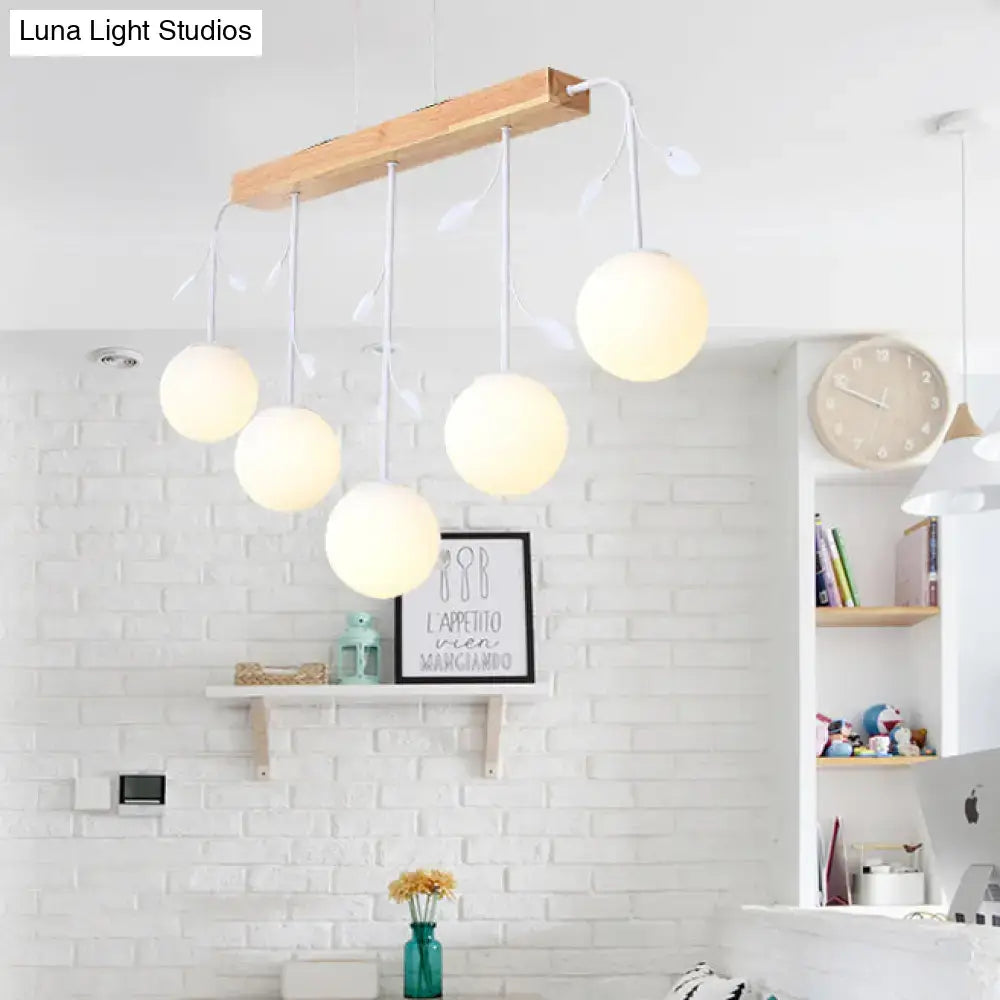 Modern DecorBites™ Nordic bubble shade island wooden hanging lamp with five warm glass bulbs and leaf accents for restaurants