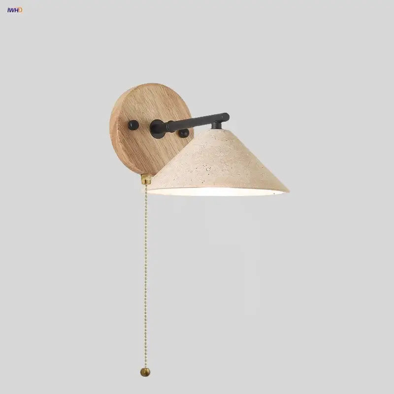 Minimalist wall light with yellow travertine cone shade, wooden circular backplate, black arm, and wood pull switch decorbites led yellow