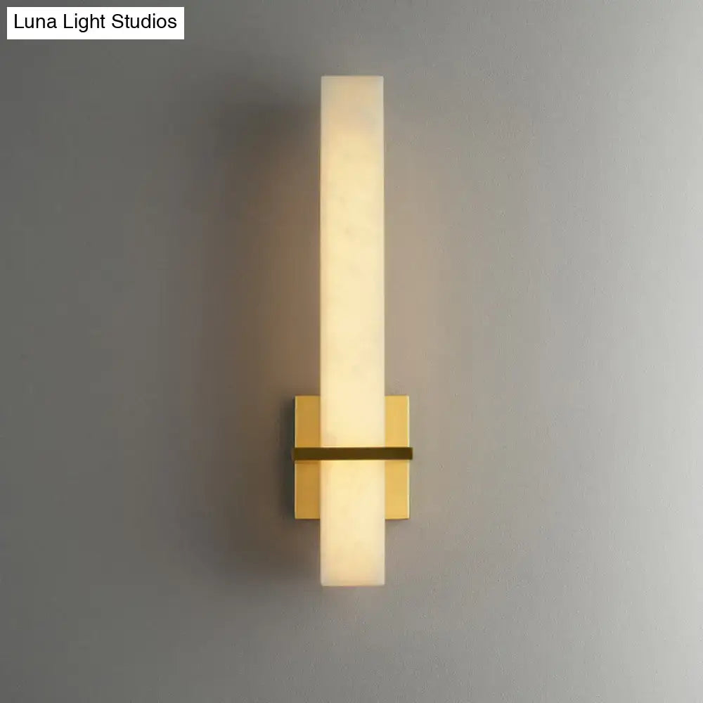 Modern minimalist wall sconce with frosted glass cylinder and brushed gold metal base for 110v-120v minimalistic marble wall use