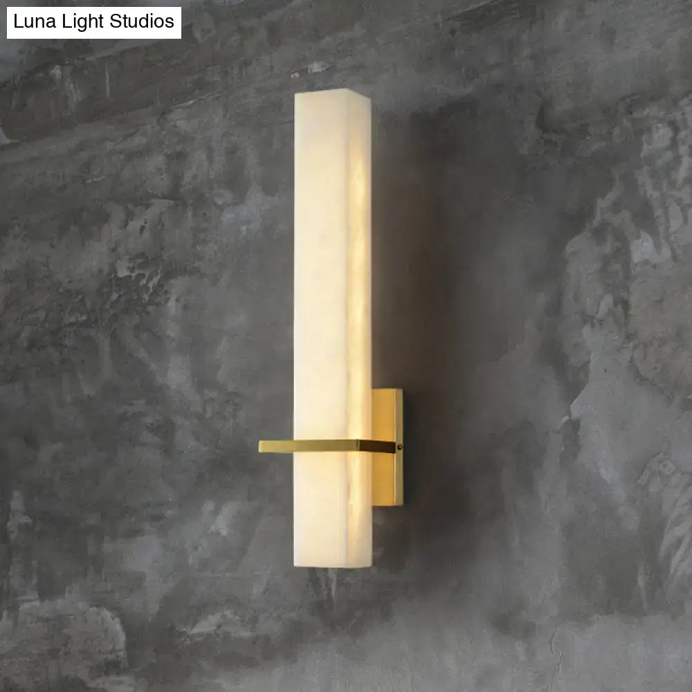 Modern rectangular wall sconce with frosted opal glass and brushed brass hardware for minimalistic marble wall 110v-120v lighting